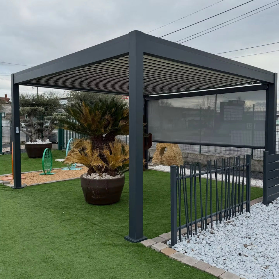 Ubloc gray aluminum electric pergola shown with optional privacy screen; landscaping and fencing excluded