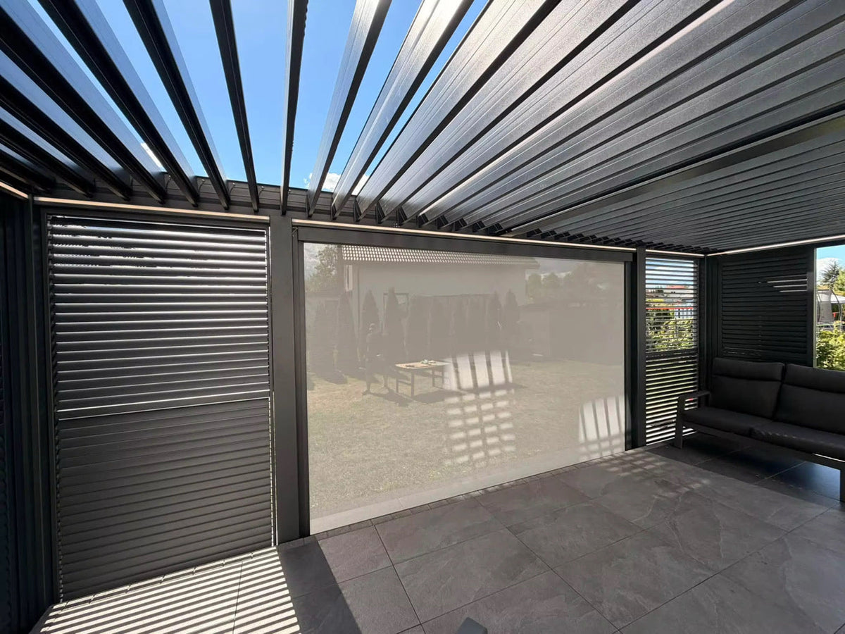 Open louvers and lighting detail in an illustrative pergola configuration with optional screen; side slat panels and furniture not included