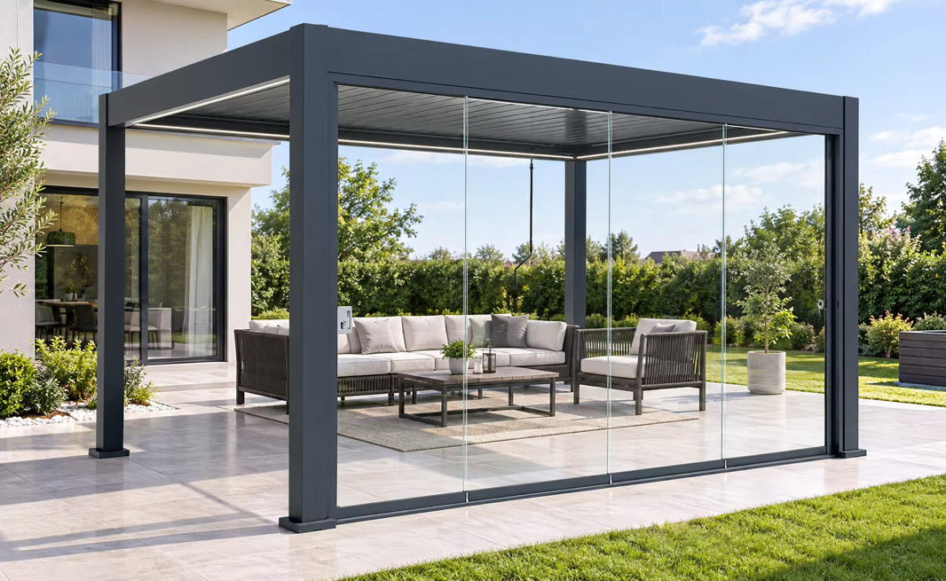 Pergola shown with optional frameless sliding glass doors and outdoor furniture; glazing upgrade sold separately