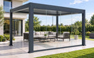 Pergola shown with optional frameless sliding glass doors and outdoor furniture; glazing upgrade sold separately