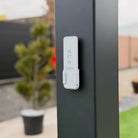 Close-up of the pergola controller mounted on a gray aluminum post; control configuration to be confirmed